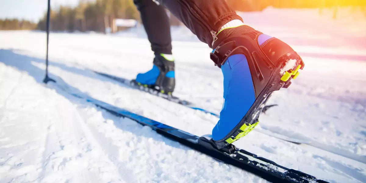 Cross country skiing Banner, winter sport on snowy track, sunset